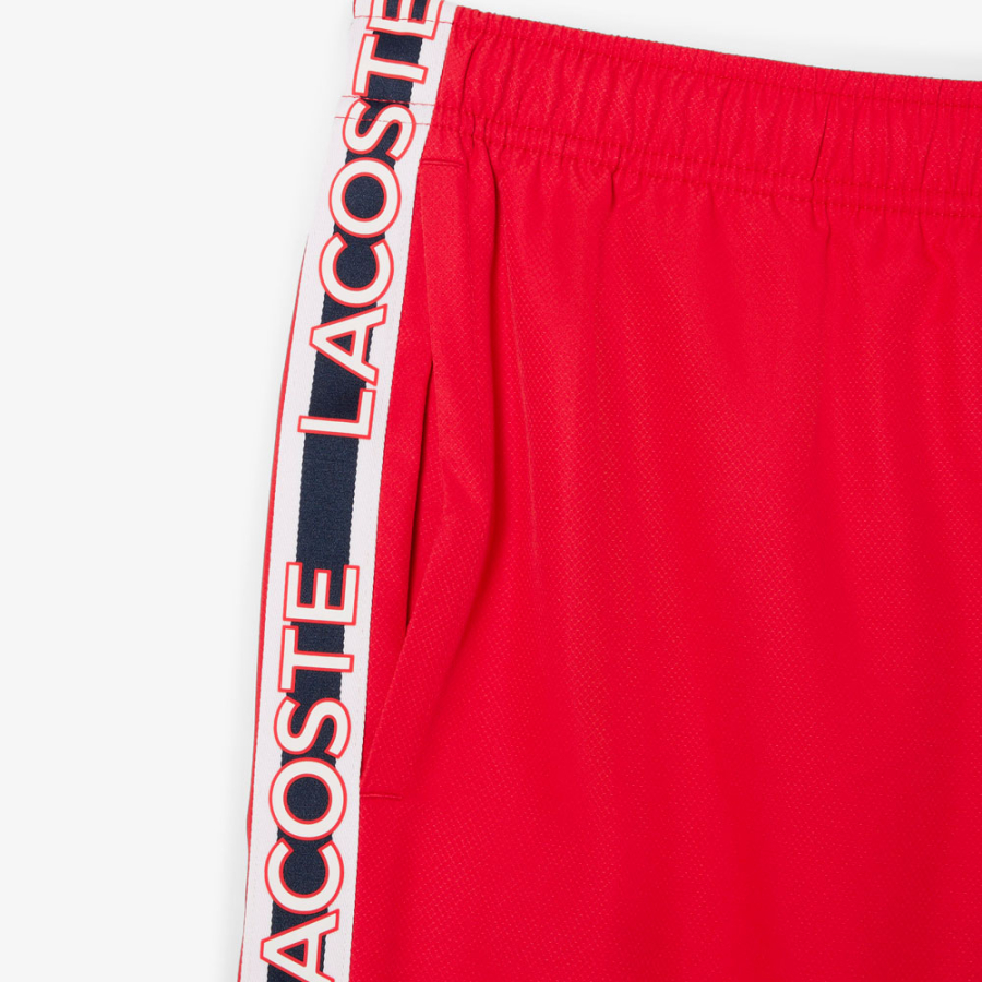 shorts-a-righe-con-logo-sportivo