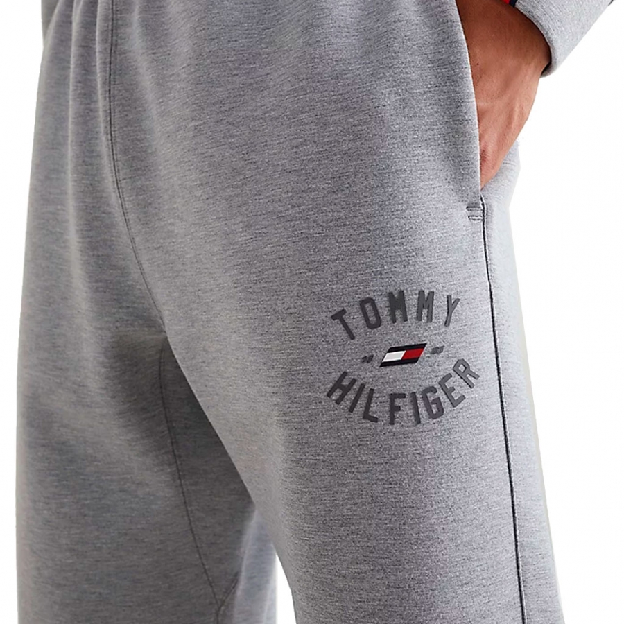 JOGGERS CON LOGO GRAFICO UNIVERSITY